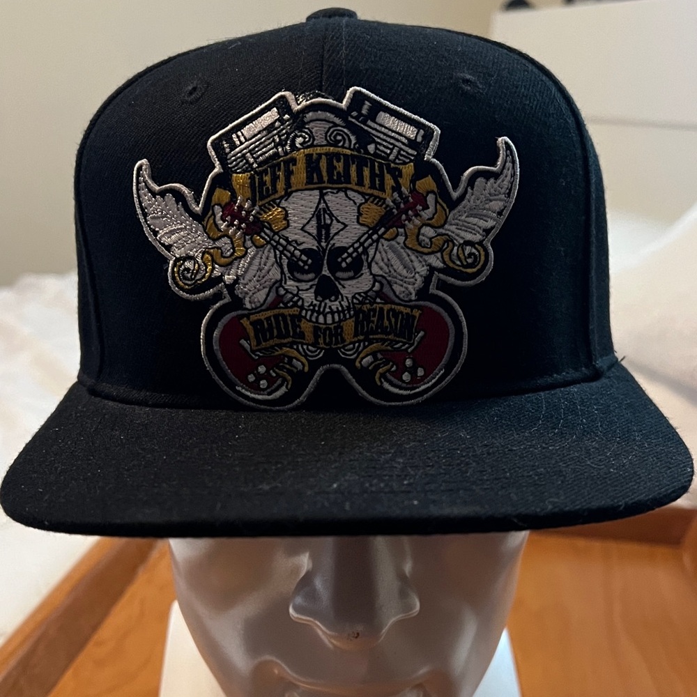 Black Snapback Hat with Embroidered Skull Crest